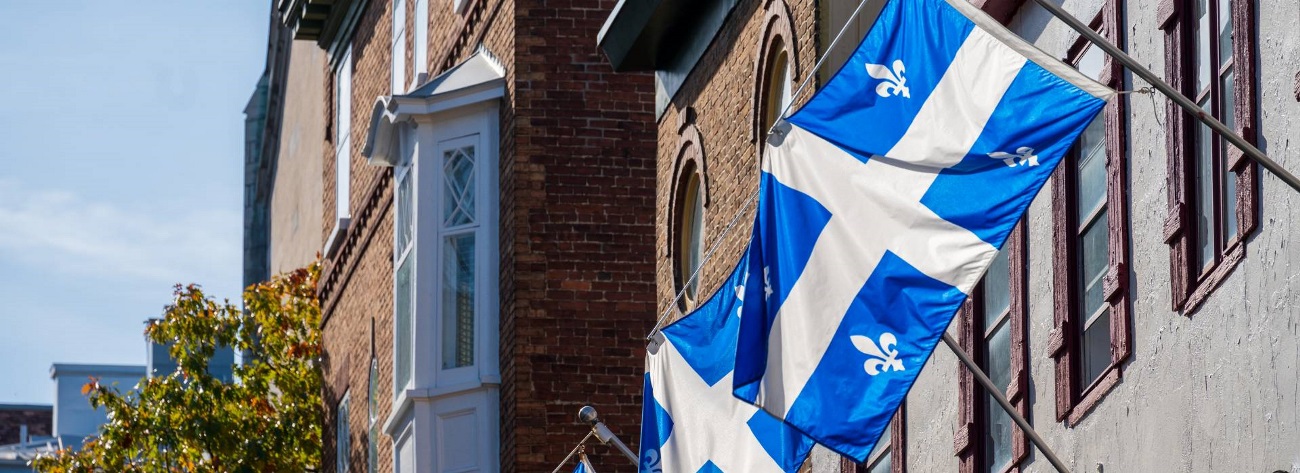 Flag of Quebec. Quebec City Old Town - Link to Webinar: impact of Bill 96 on product trademarks