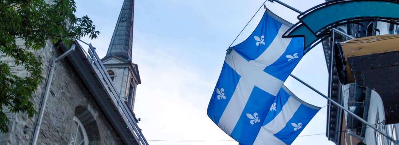 Quebec Flags in front of buildings